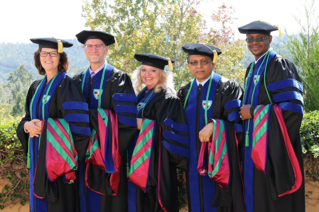 DPhil/PhD from Omega Graduate School